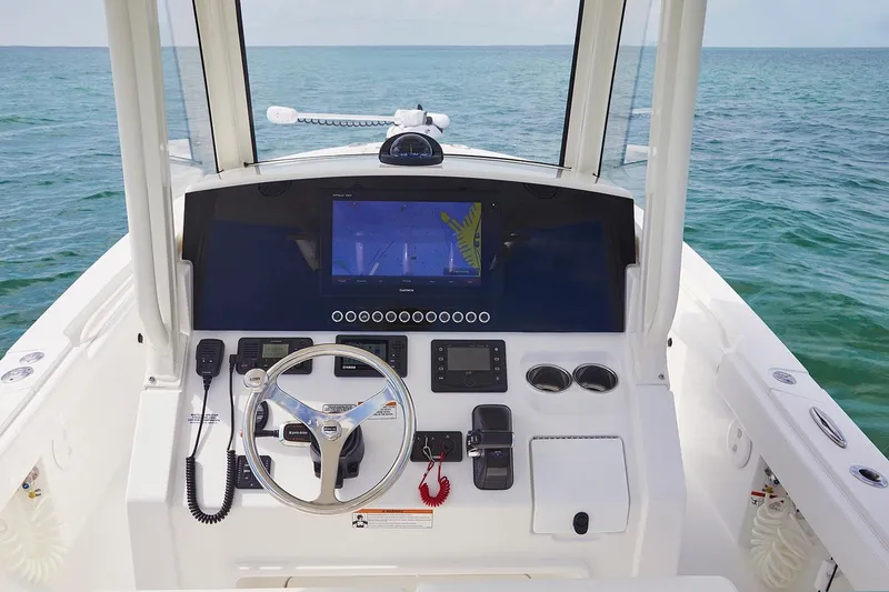 Slide: The Image of 2024 Regulator 26XO boat interior with compact marine toilet. - 13