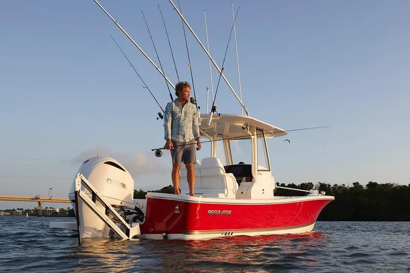 Slide: The Image of 2024 Regulator 26XO boat cockpit with steering wheel and control panel. - 7