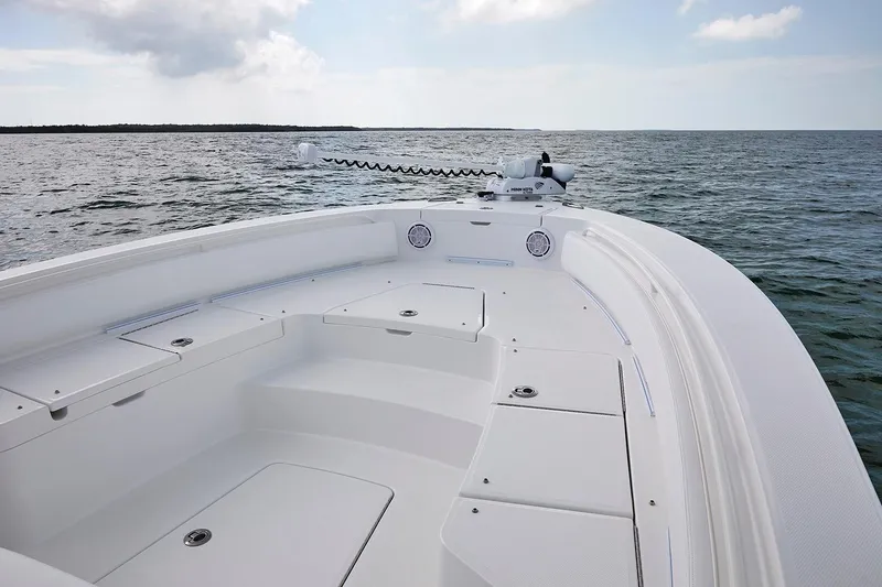 Slide: The Image of 2024 Regulator 26XO boat dashboard with Garmin displays and steering wheel. - 8