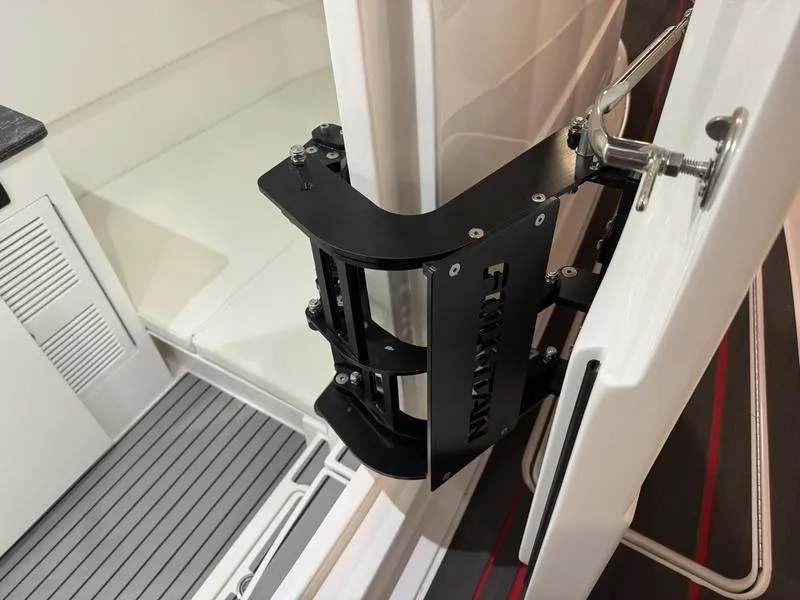 Slide: The Image of 2025 Fountain 43 SCX boat interior with a secure door latch mechanism. - 12