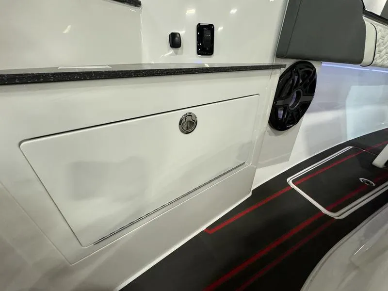 Slide: The Image of 2025 Fountain 43 SCX interior detail with storage compartment and speaker. - 13