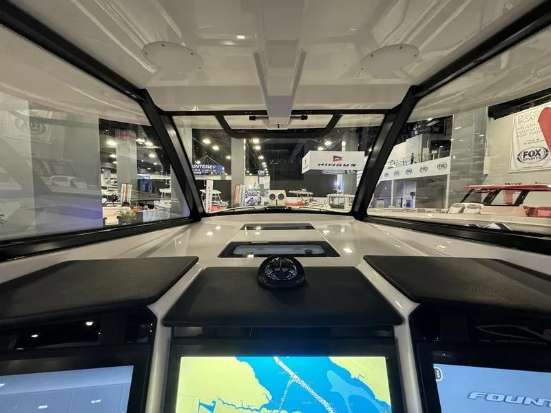 Slide: The Image of Interior view of 2025 Fountain 43 SCX boat dashboard with navigation screens. - 16
