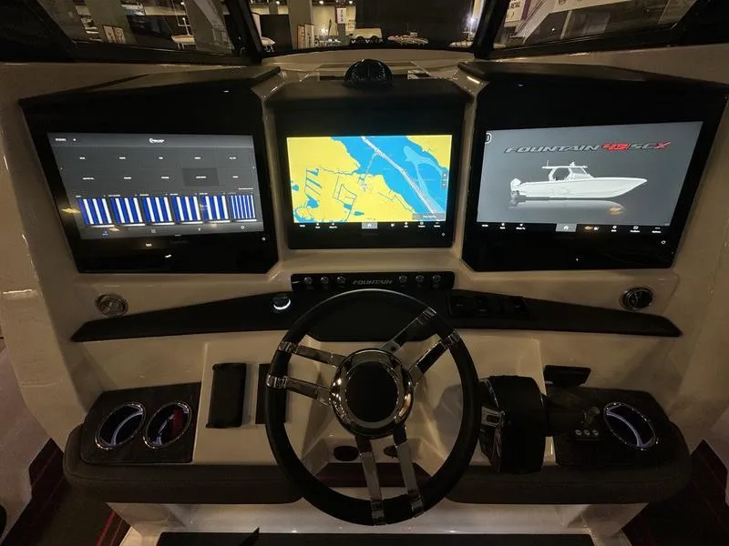 Slide: The Image of Fountain 43 SCX 2025 boat dashboard with advanced navigation and control screens. - 21