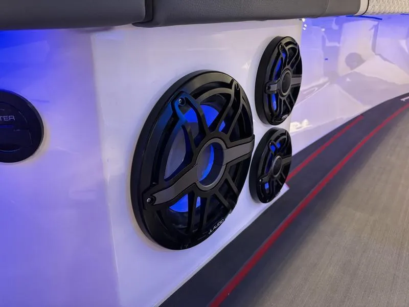 Slide: The Image of Close-up of 2025 Fountain 43 SCX boat speakers with blue LED lighting. - 26