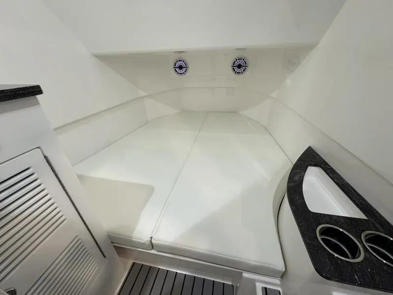 Slide: The Image of Interior cabin of 2025 Fountain 43 SCX boat with cushioned seating and storage. - 3