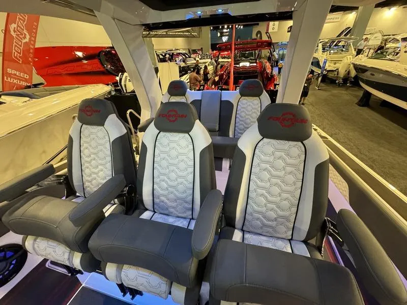 Slide: The Image of Luxury seating inside the 2025 Fountain 43 SCX speedboat at a boat show. - 8