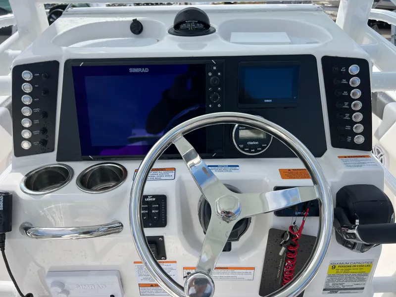 Slide: The Image of 2024 Robalo 246 Sky Deck boat helm with modern navigation system and controls. - 8