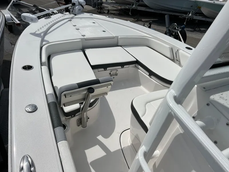 Slide: The Image of 2024 Robalo 246 Sky Deck boat interior with white seating and deck. - 9