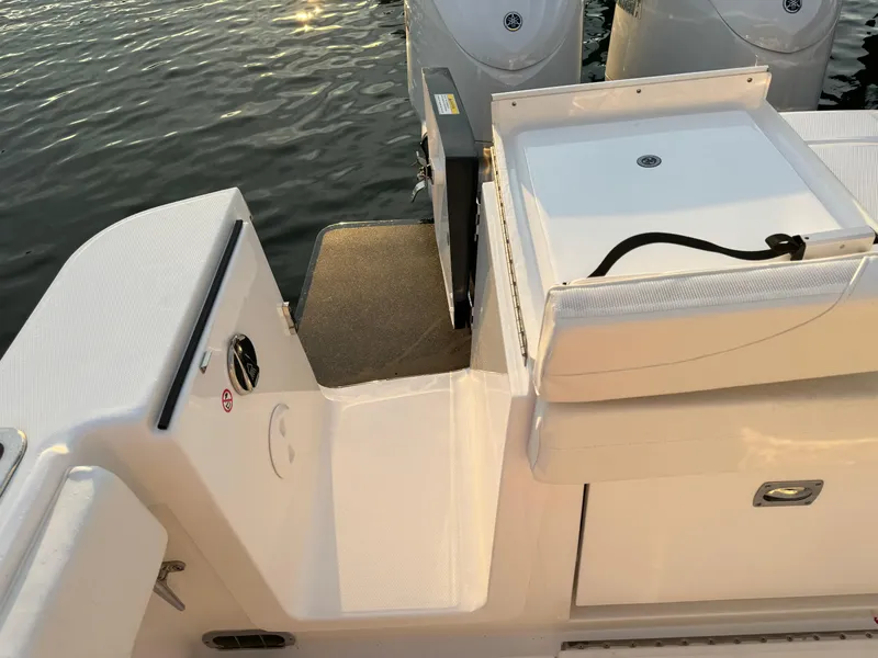 Slide: The Image of 2024 Regulator 28 boat deck with dual engines, featuring sleek design and modern amenities. - 12