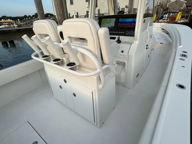Slide: The Image of 2024 Regulator 28 boat interior with dual seats and control panel. - 21
