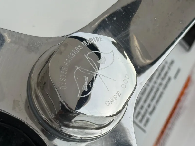 Slide: The Image of Close-up of a 2024 Regulator 28 boat propeller with engraved logo. - 29