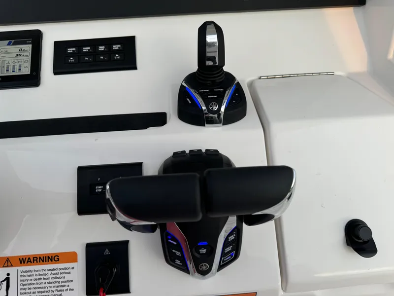 Slide: The Image of 2024 Regulator 28 boat controls with advanced navigation system. - 30