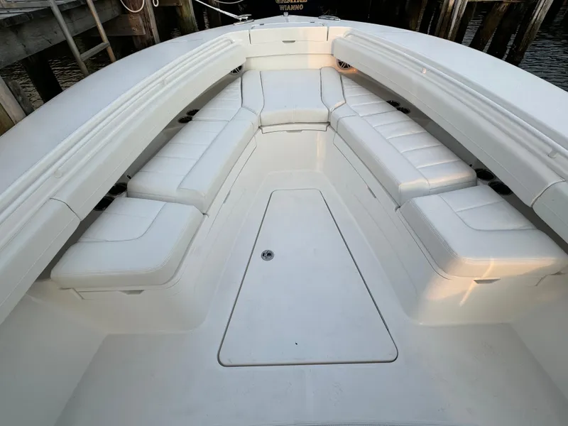 Slide: The Image of 2024 Regulator 28 boat interior with white cushioned seating. - 36