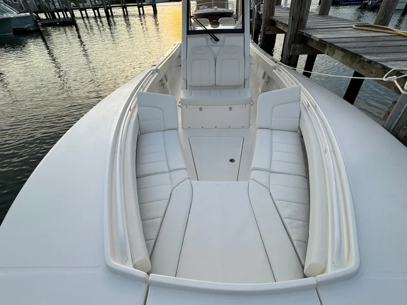 Slide: The Image of 2024 Regulator 28 boat with spacious seating, docked at sunset. - 37