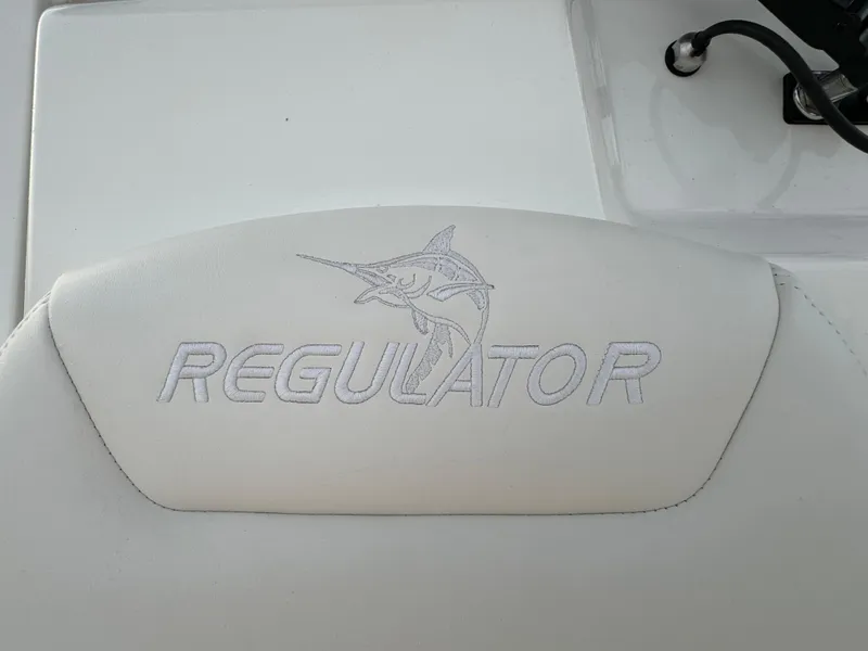 Slide: The Image of 2024 Regulator 28 boat seat with embroidered logo and marlin design. - 43