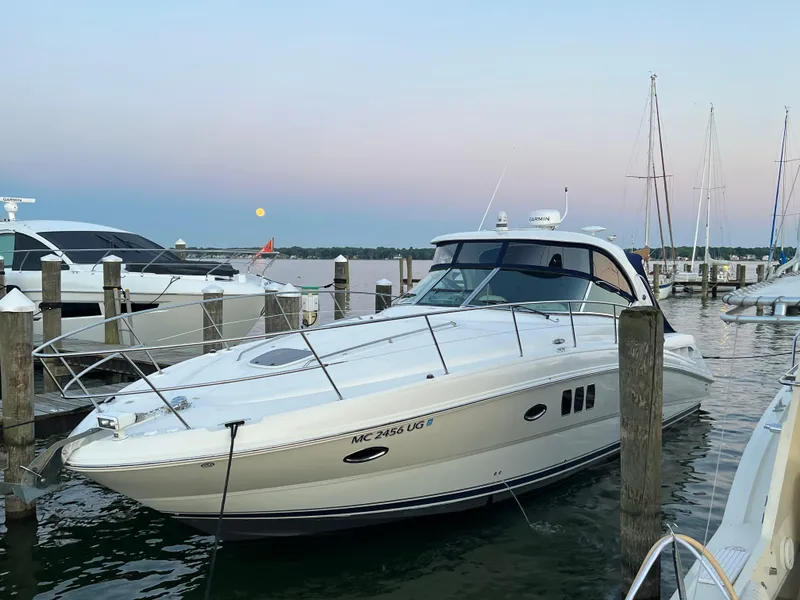 Slide: The Image of 2008 Sea Ray 38 Sundancer yacht docked at marina during sunset. - 0