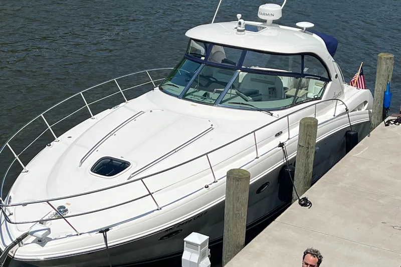 Slide: The Image of 2008 Sea Ray 38 Sundancer docked at a marina. - 1