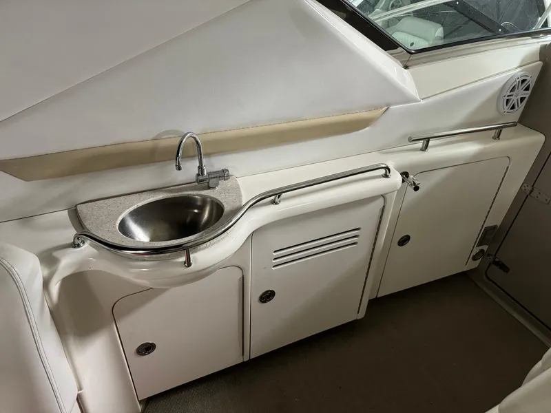 Slide: The Image of 2008 Sea Ray 38 Sundancer yacht interior with sink and storage cabinets. - 12