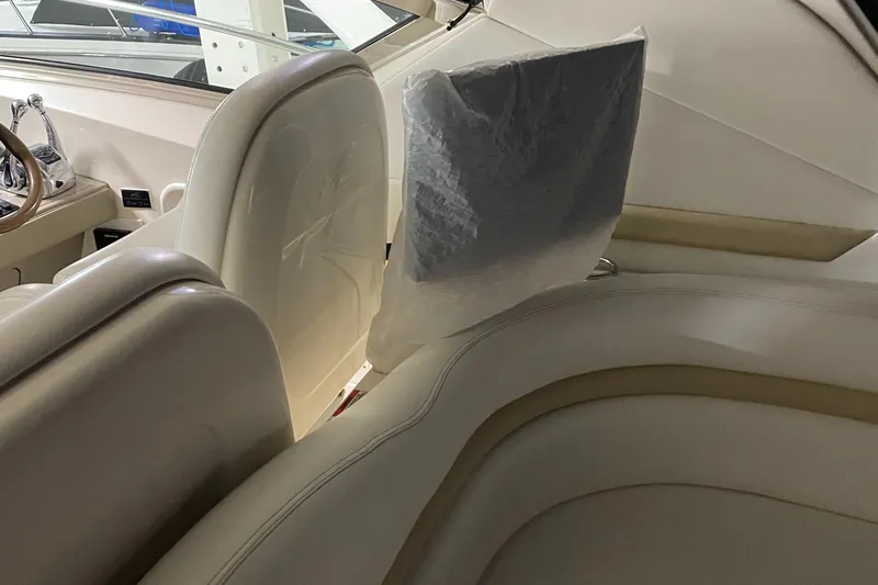 Slide: The Image of Interior seating of 2008 Sea Ray 38 Sundancer yacht with white leather upholstery. - 14