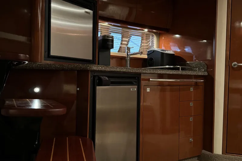 Slide: The Image of Interior kitchen area of 2008 Sea Ray 38 Sundancer yacht with modern appliances. - 22