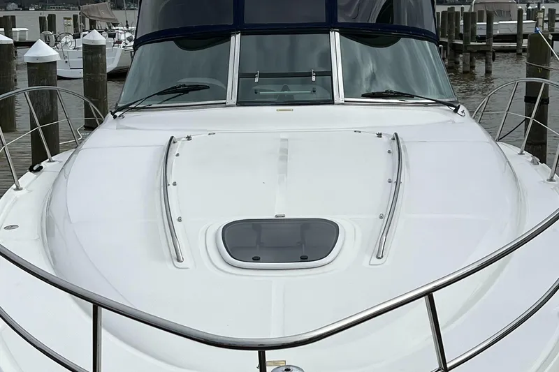 Slide: The Image of 2008 Sea Ray 38 Sundancer yacht docked at a marina. - 3