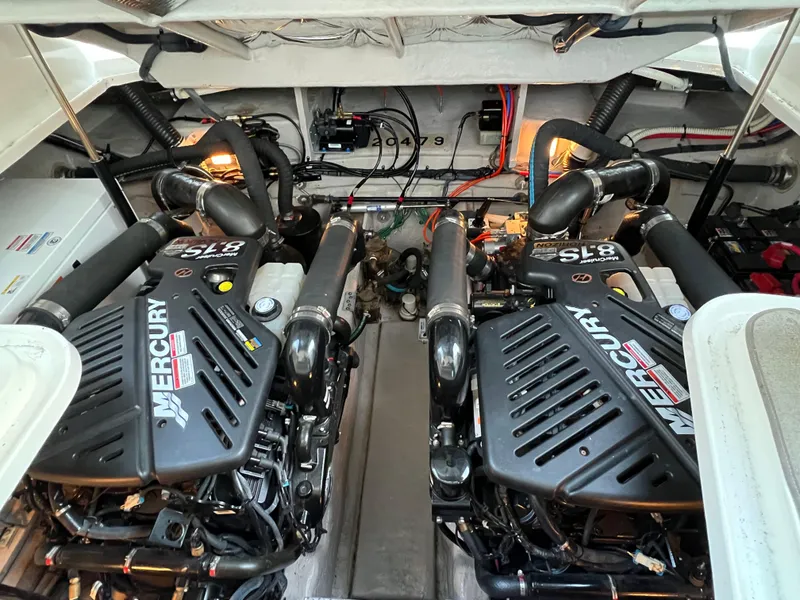 Slide: The Image of 2008 Sea Ray 38 Sundancer engine room with twin Mercury engines. - 33