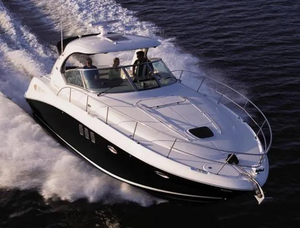 Slide: The Image of 2008 Sea Ray 38 Sundancer cruising on water. - 35