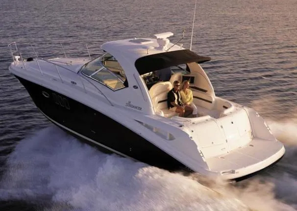 Slide: The Image of 2008 Sea Ray 38 Sundancer cruising on open water. - 36