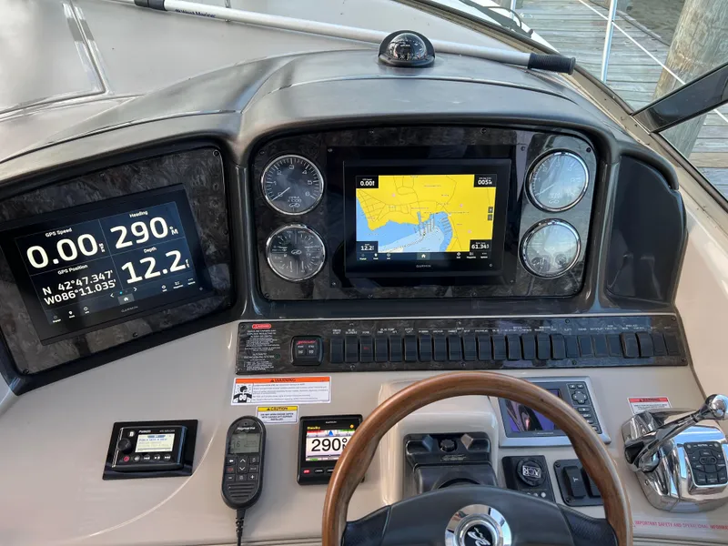 Slide: The Image of Helm of 2008 Sea Ray 38 Sundancer with navigation and control systems. - 8