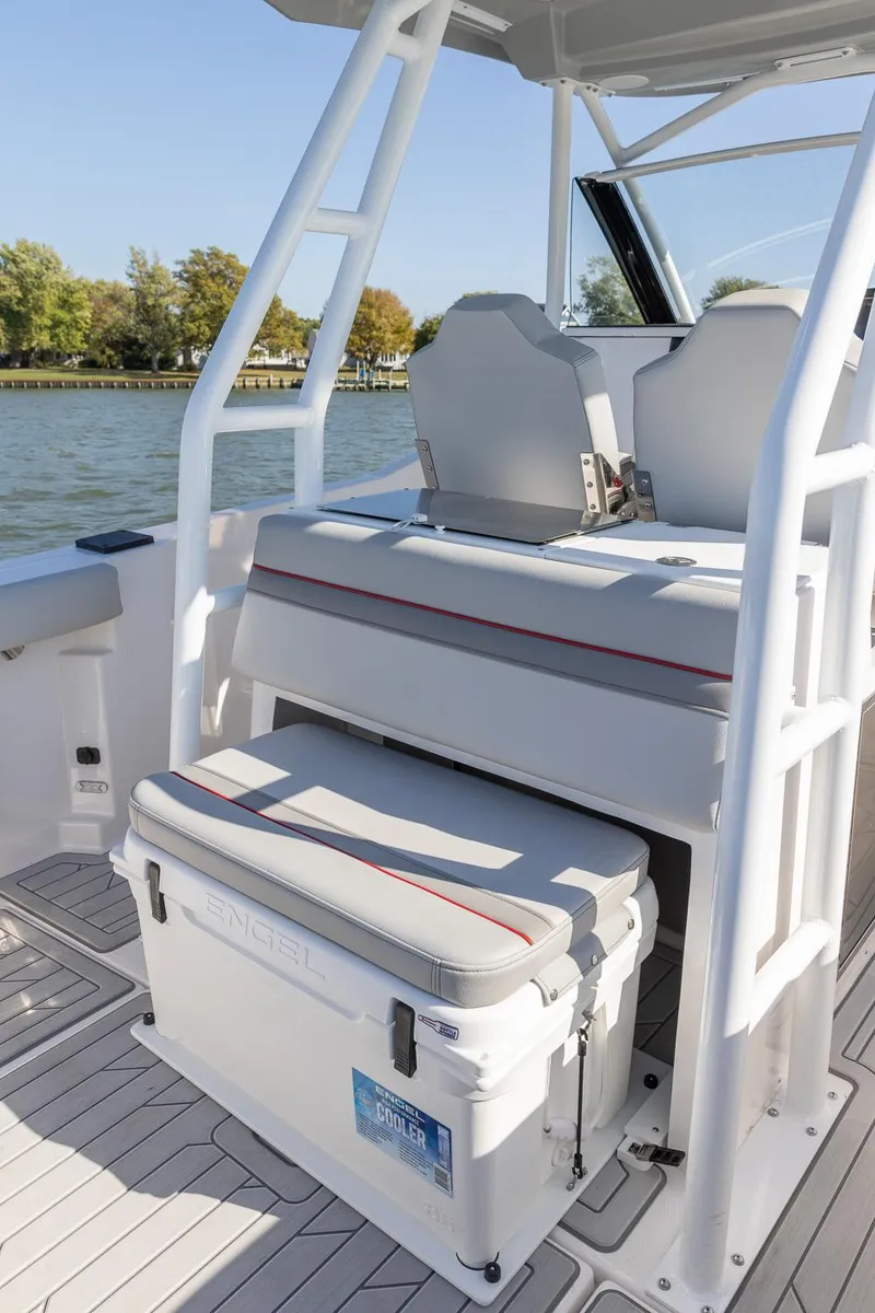 Slide: The Image of 2024 Solara 250 CW boat interior with seating and cooler on deck. - 19