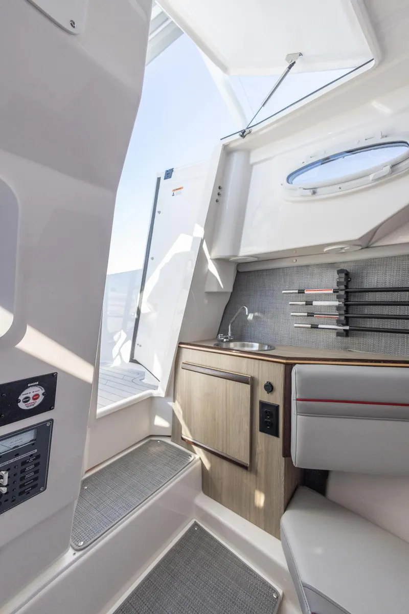 Slide: The Image of 2024 Solara 250 CW boat interior with kitchenette, sink, and knife holder. - 28