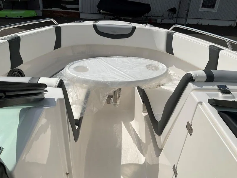 Slide: The Image of 2024 Chaparral 250 OSX boat interior with seating and table. - 16