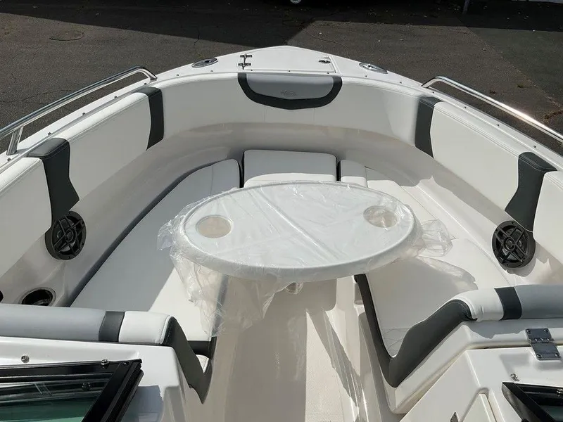 Slide: The Image of 2024 Chaparral 250 OSX boat interior with seating and table. - 17