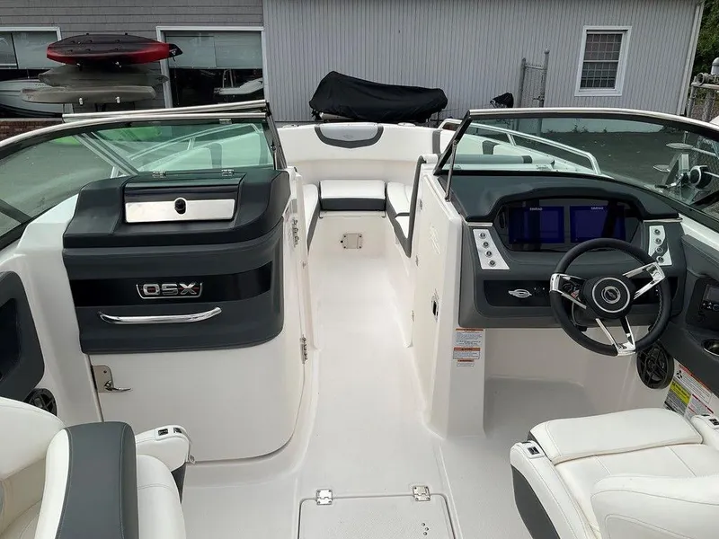 Slide: The Image of 2024 Chaparral 250 OSX boat interior with modern dashboard and seating. - 20