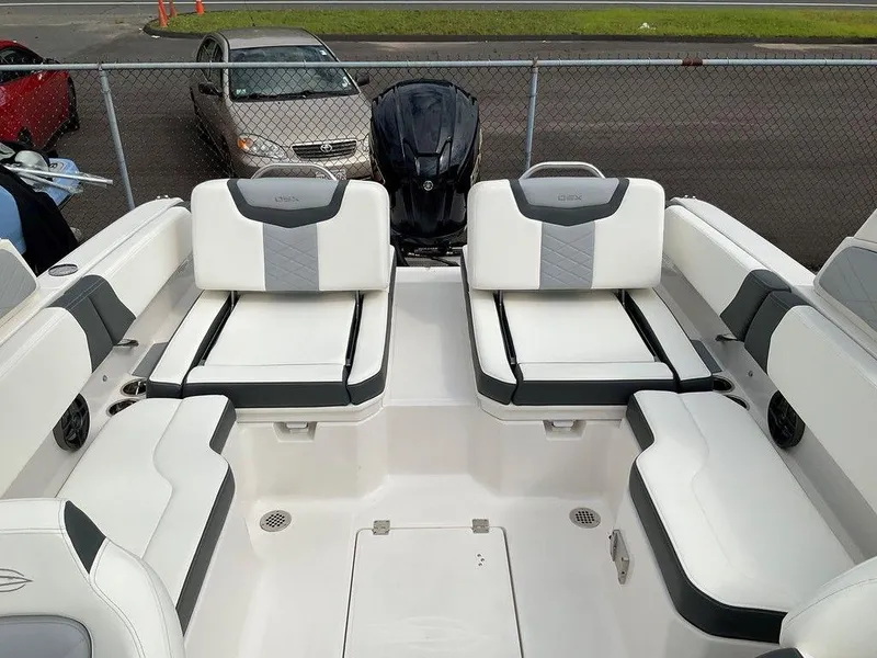 Slide: The Image of 2024 Chaparral 250 OSX boat interior with white and gray seating. - 30