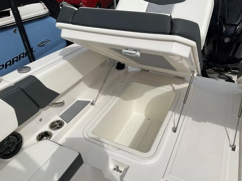Slide: The Image of 2024 Chaparral 250 OSX boat interior with open storage compartment. - 37