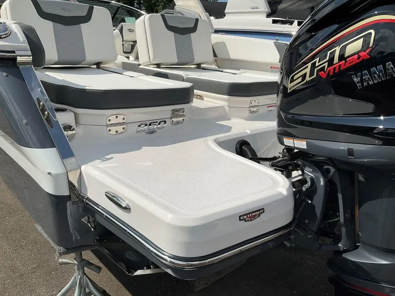 Slide: The Image of 2024 Chaparral 250 OSX boat with Yamaha SHO VMAX engine, featuring sleek seating and swim platform. - 42