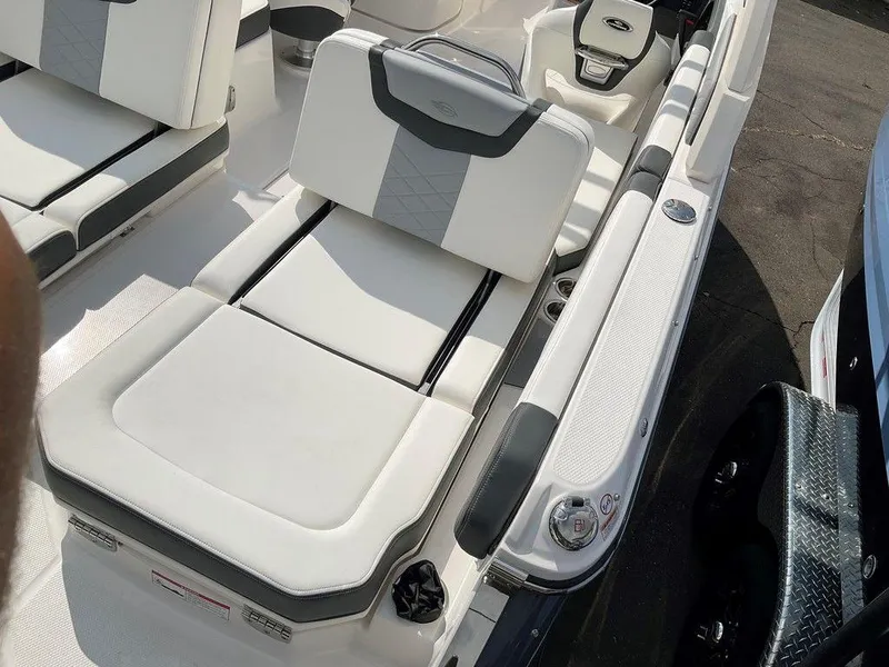 Slide: The Image of 2024 Chaparral 250 OSX boat interior with white and gray seating. - 46
