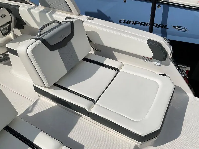 Slide: The Image of 2024 Chaparral 250 OSX boat interior with luxurious white seating. - 49