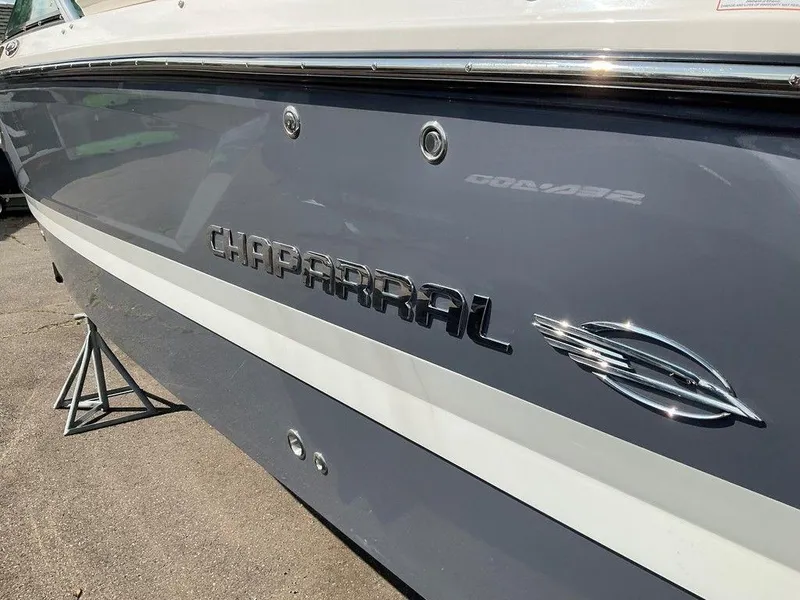 Slide: The Image of 2024 Chaparral 250 OSX boat side view with logo and emblem. - 6