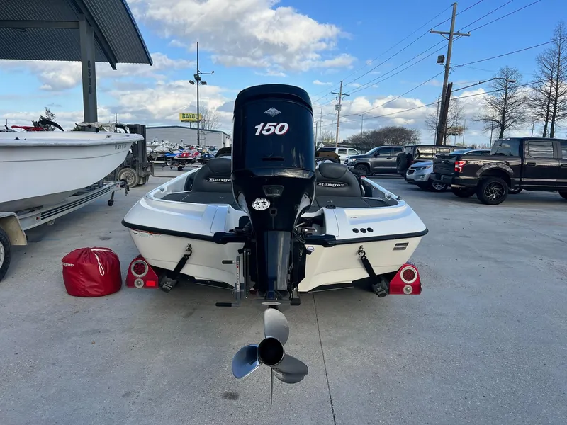 Slide: The Image of 2007 Ranger 188VX boat with 150 HP motor in a parking lot. - 3