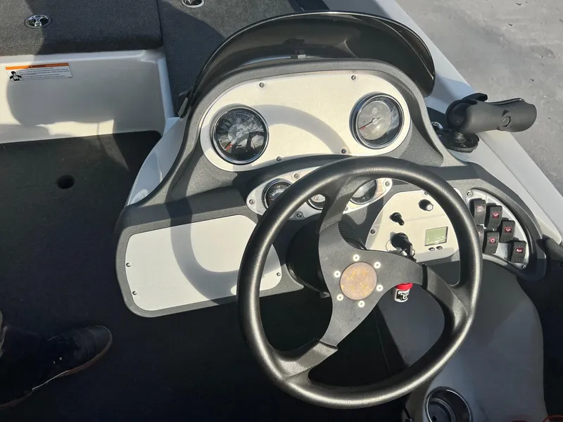 Slide: The Image of 2007 Ranger 188VX boat dashboard with steering wheel and instrument panel. - 6