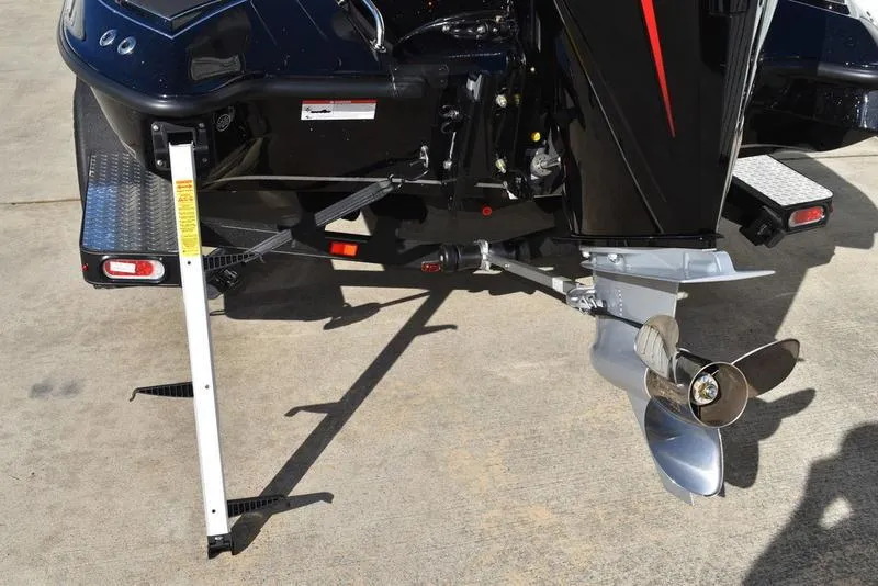 Slide: The Image of 2024 Triton 18 TrX boat motor and propeller on concrete surface. - 10