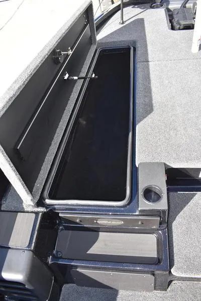 Slide: The Image of 2024 Triton 18 TrX boat storage compartment. - 14