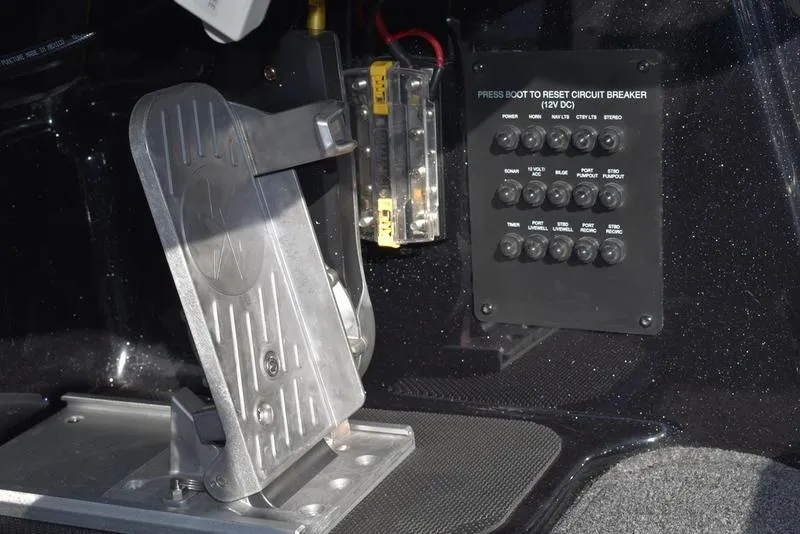 Slide: The Image of 2024 Triton 18 TrX boat control panel and foot pedal. - 23