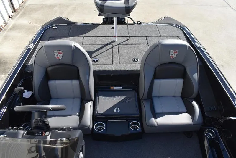 Slide: The Image of 2024 Triton 18 TrX boat interior with dual seats and steering console. - 24