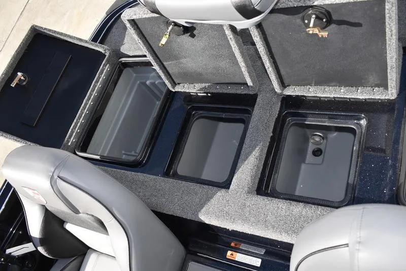 Slide: The Image of 2024 Triton 18 TrX boat storage compartments and seating. - 26