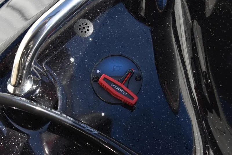 Slide: The Image of Close-up of 2024 Triton 18 TrX boat drain plug. - 28
