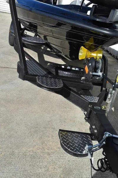 Slide: The Image of 2024 Triton 18 TrX boat trailer with diamond plate steps. - 6