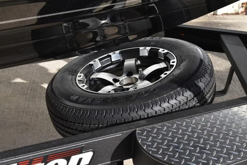 Slide: The Image of Spare tire on a 2024 Triton 18 TrX boat trailer. - 7